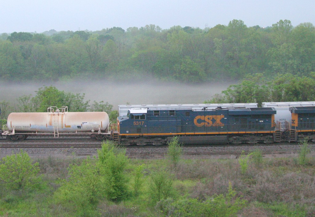 Fog forming over the river as trains meet